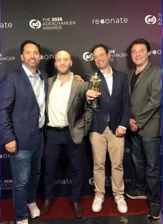 David Nyurenberg, second from left, with InterMedia colleagues and the trophy at the 2026 AdExchanger Awards
